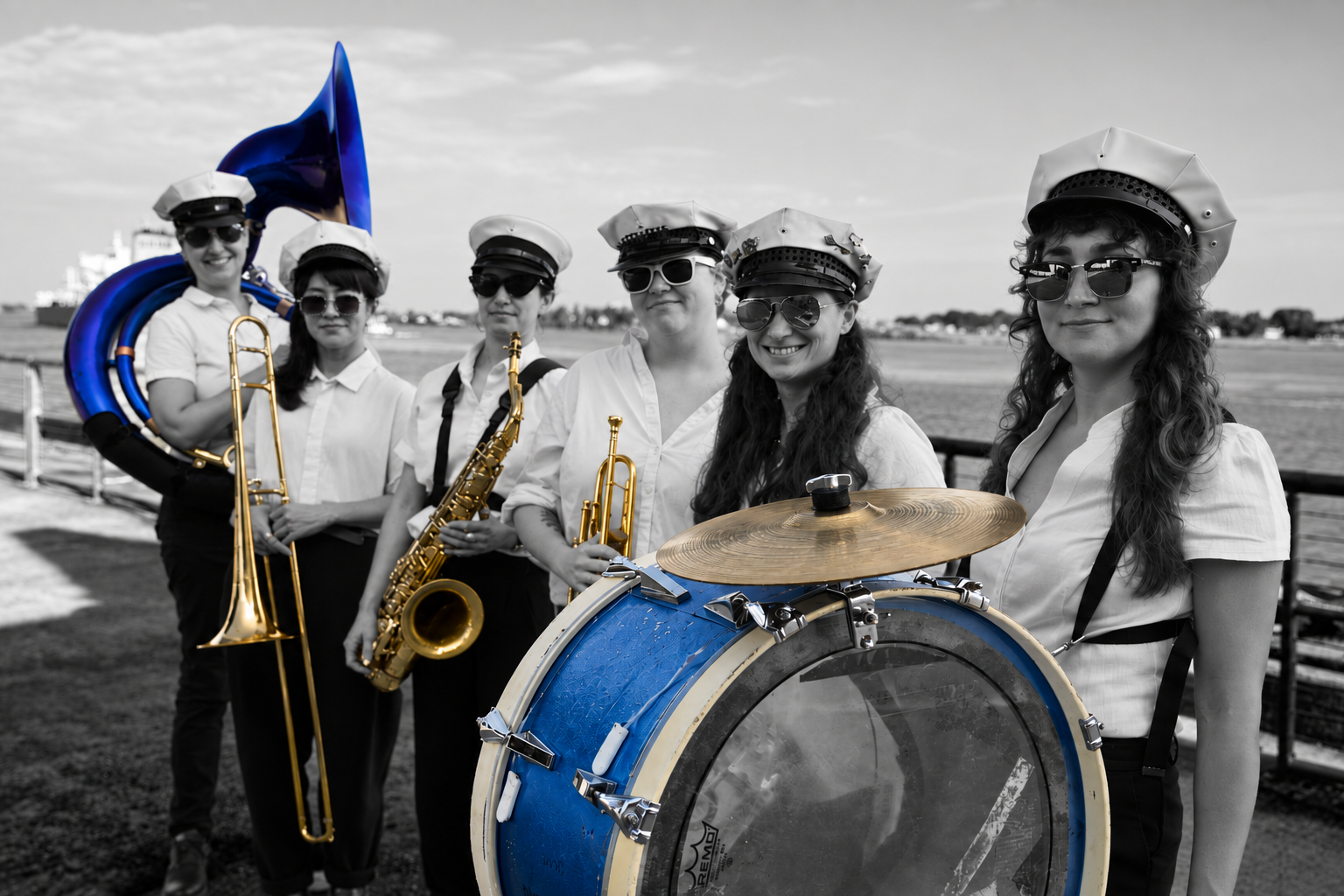 Women musicians of Divas Brass Band with sousaphone and bass drum in New Orleans