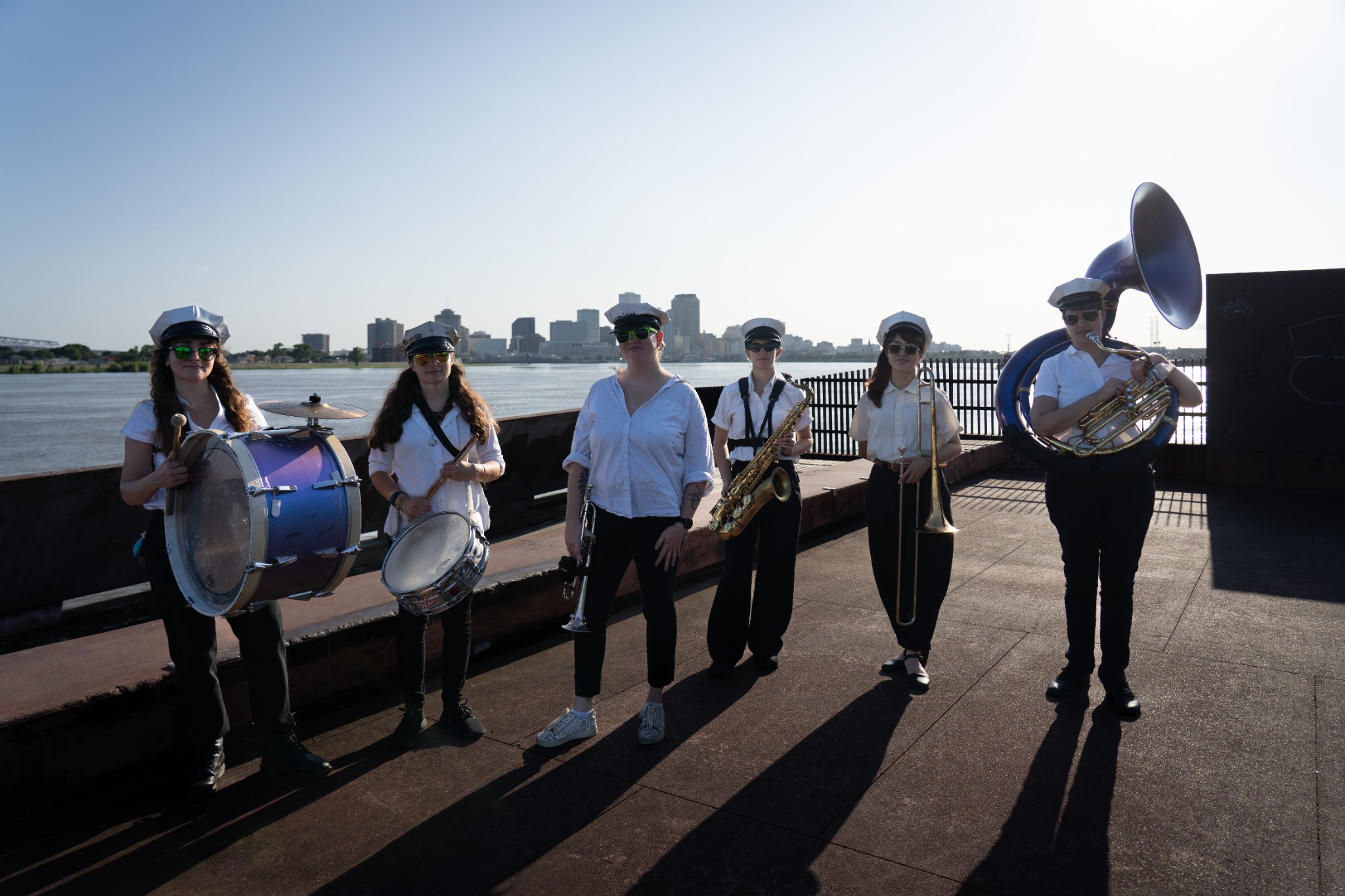 Divas Brass Band, a female brass band in New Orleans, with the city skyline